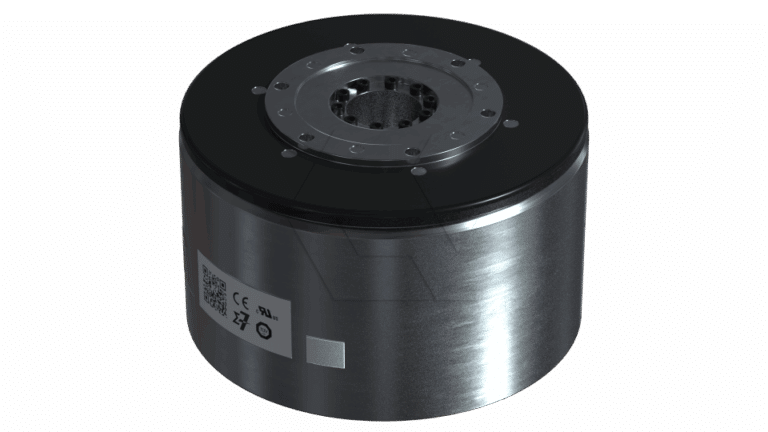 A cylindrical metallic device with a black top, several screws, and a gear-like center opening; a label with a QR code and certification symbols is visible on the side.