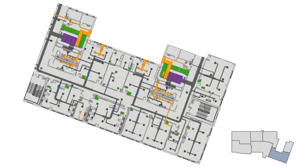 A 2D floor plan of a building showing rooms, hallways, staircases, elevators, and mechanical areas in various colors, with a small inset map highlighting a region in the southwestern United States.