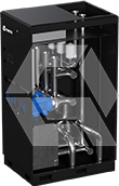 A black rectangular industrial machine with exposed internal metal pipes and components, partially covered by a transparent panel, displaying its internal structure.