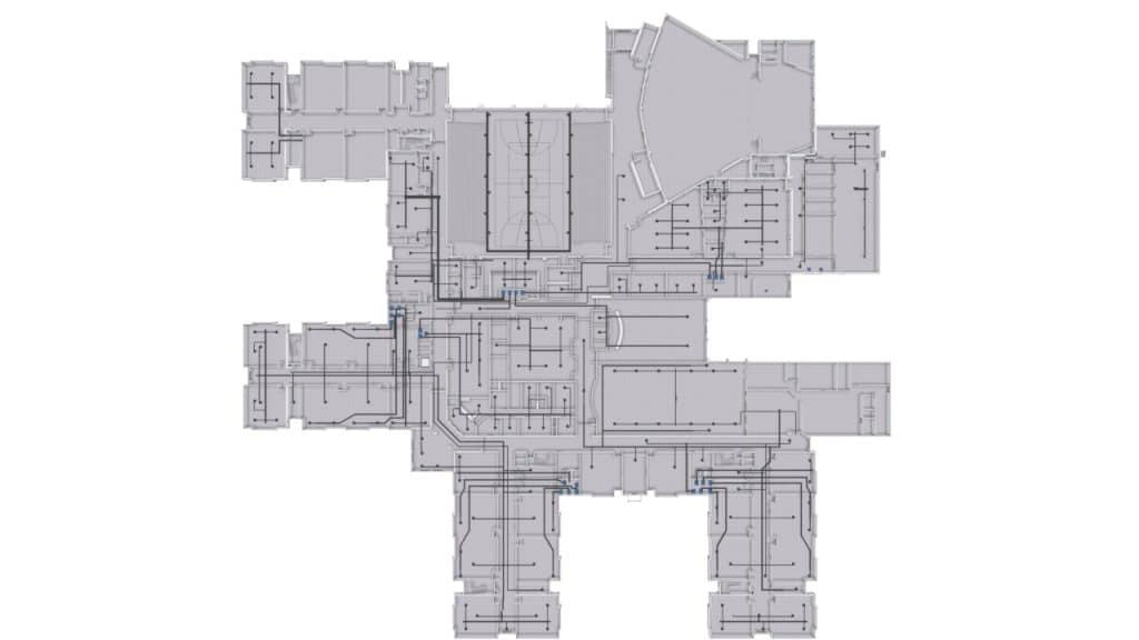 Floor plan of a building layout showing a network of utility lines routed through hallways and rooms.